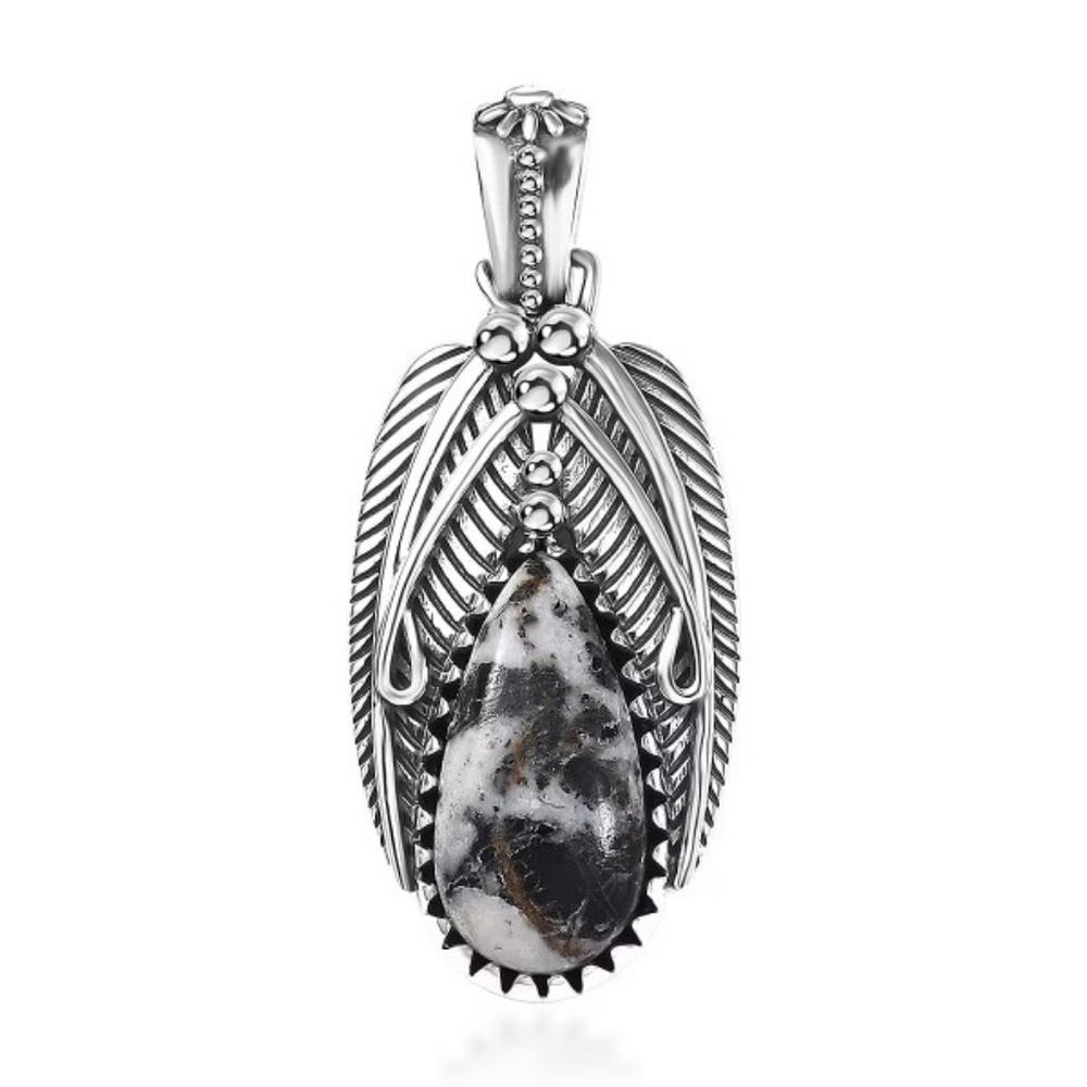 White Buffalo bezel set in an oxidized Sterling Silver Feather